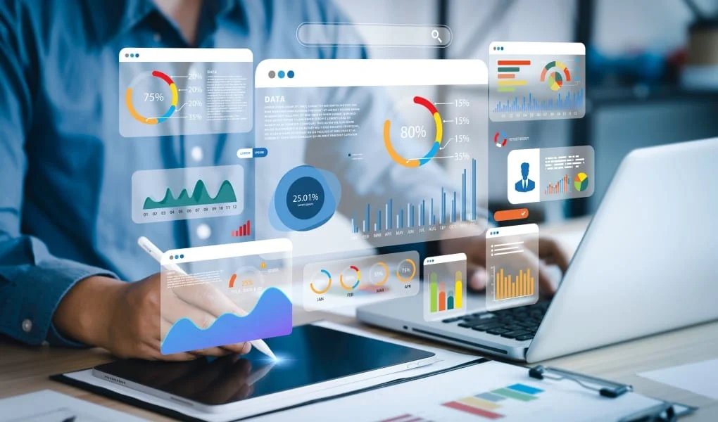 An analyst uses a computer and dashboard for data business analysis and Data Management System with KPI and metrics connected to the database for technology finance, operations, sales, marketing