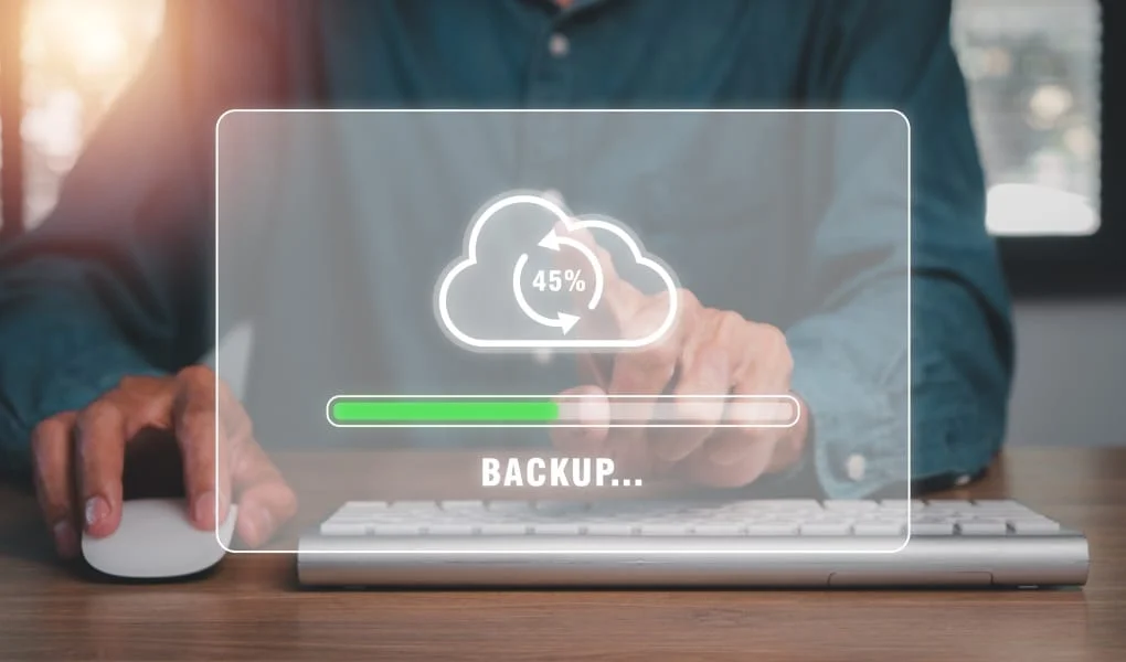 Backup concept, Business person hand touching backup icon on cirtual screen.
