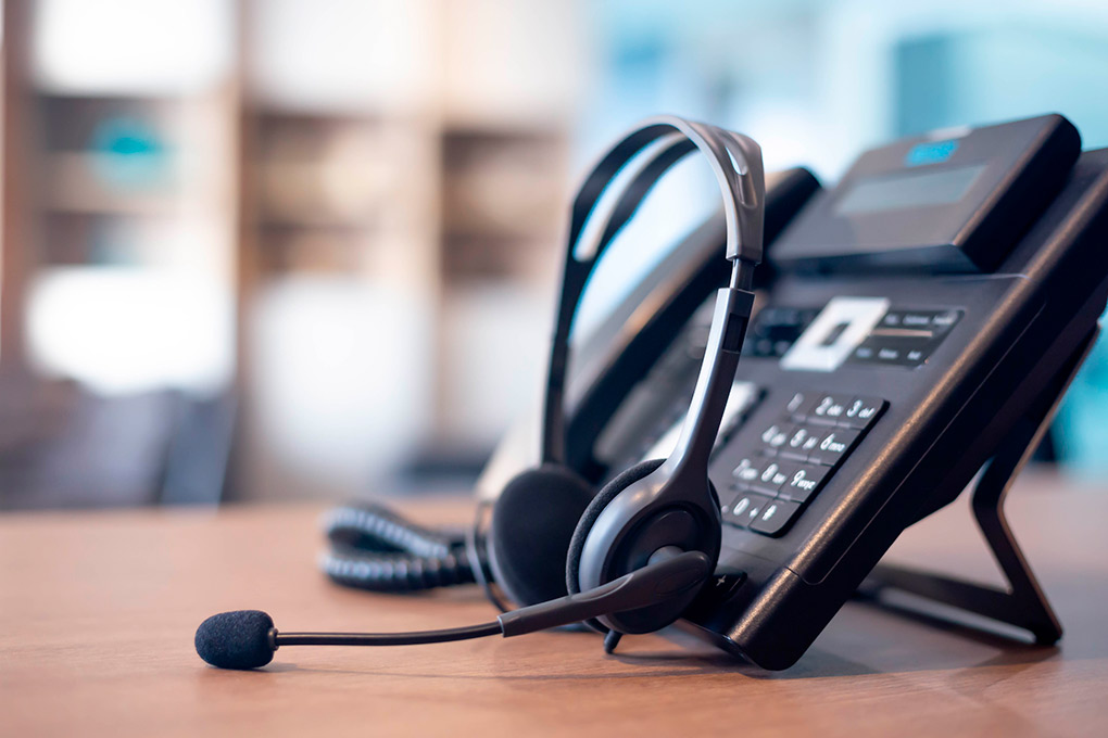 telephone and headphones: VoIP systems. 