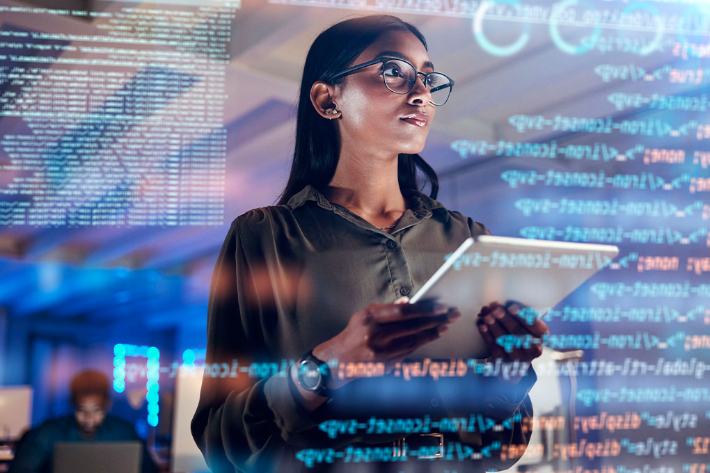tech woman holding iPad and reviewing data